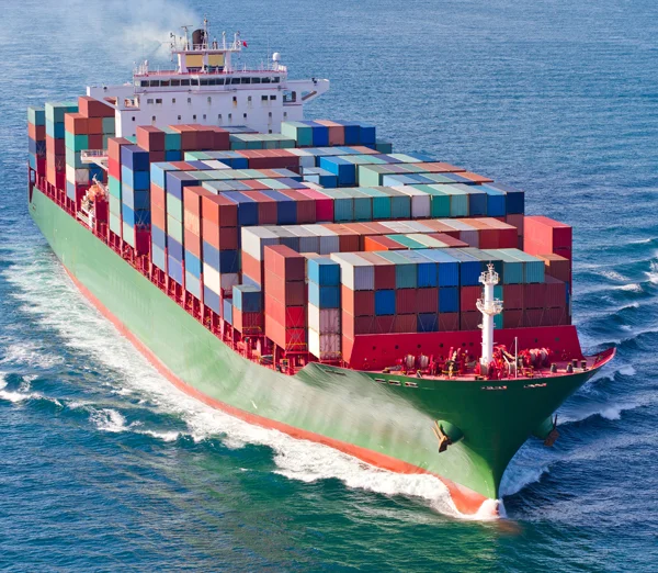 Cargo ship transporting international freight containers across the ocean.